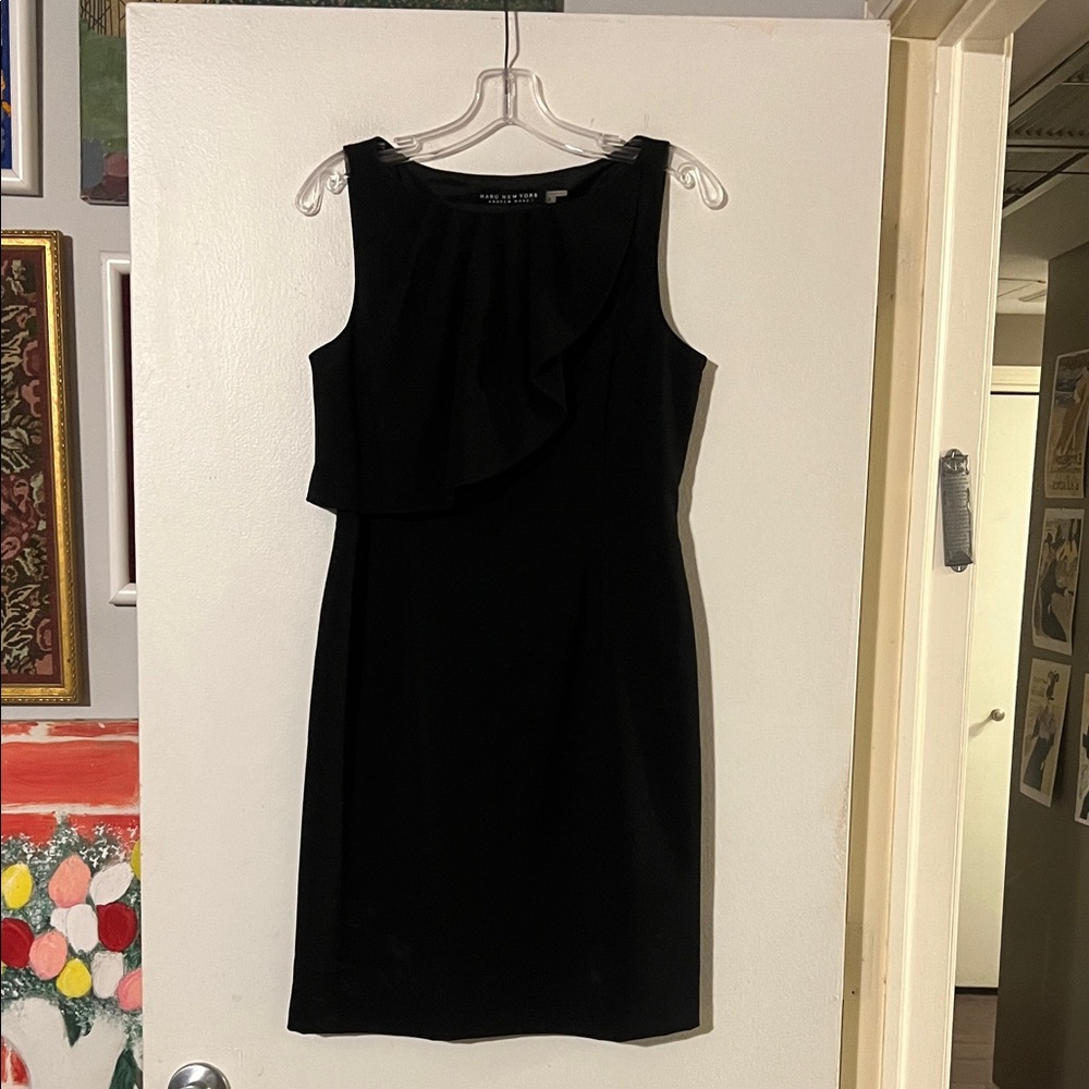Andrew Marc New York black sleeveless dress. Asymmetrical ruffle detail Side zip